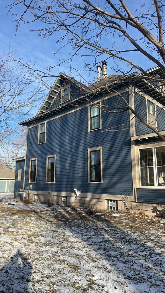 Side View of Blue House After — Carver, MN — TJ Exteriors Inc.