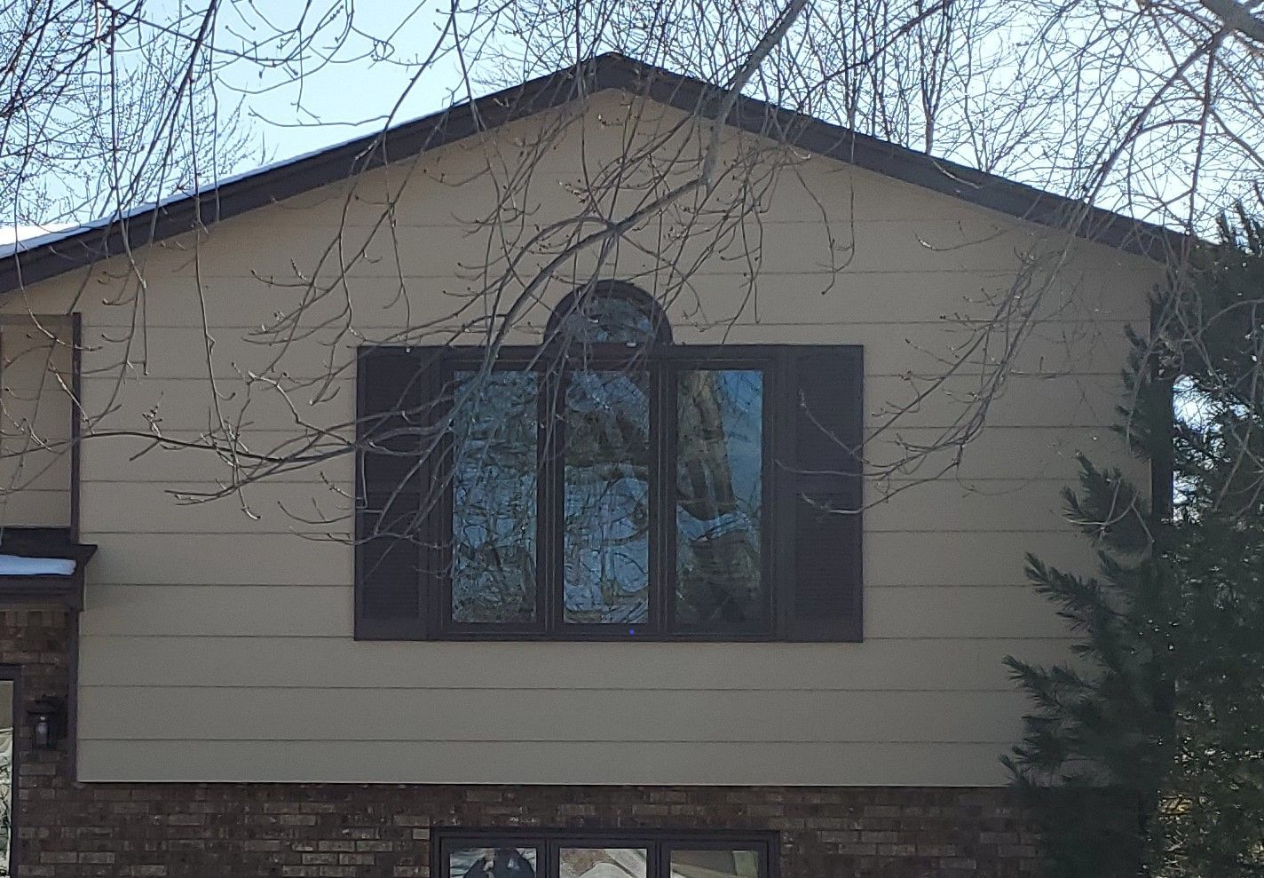 House Window Before — Carver, MN — TJ Exteriors Inc.