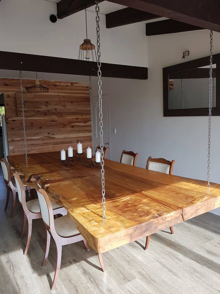 Hanging table with candles on top of it.