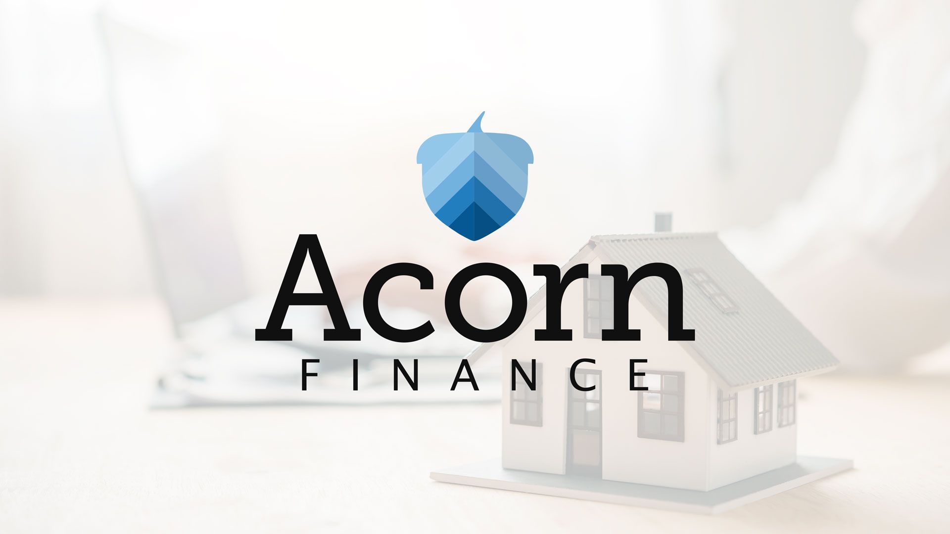 The logo for acorn finance is shown next to a model house.