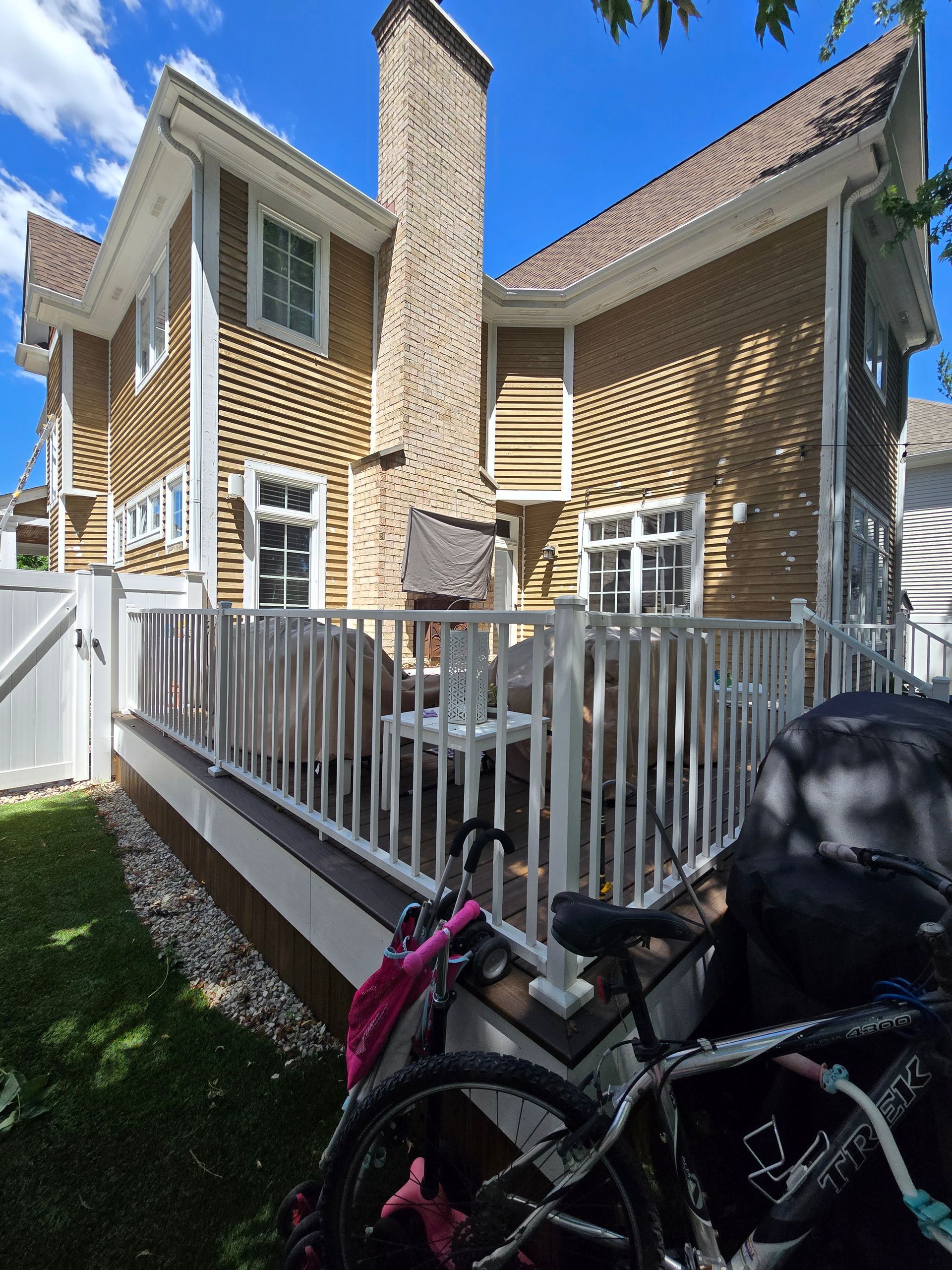 A house with a deck and bikes parked on it