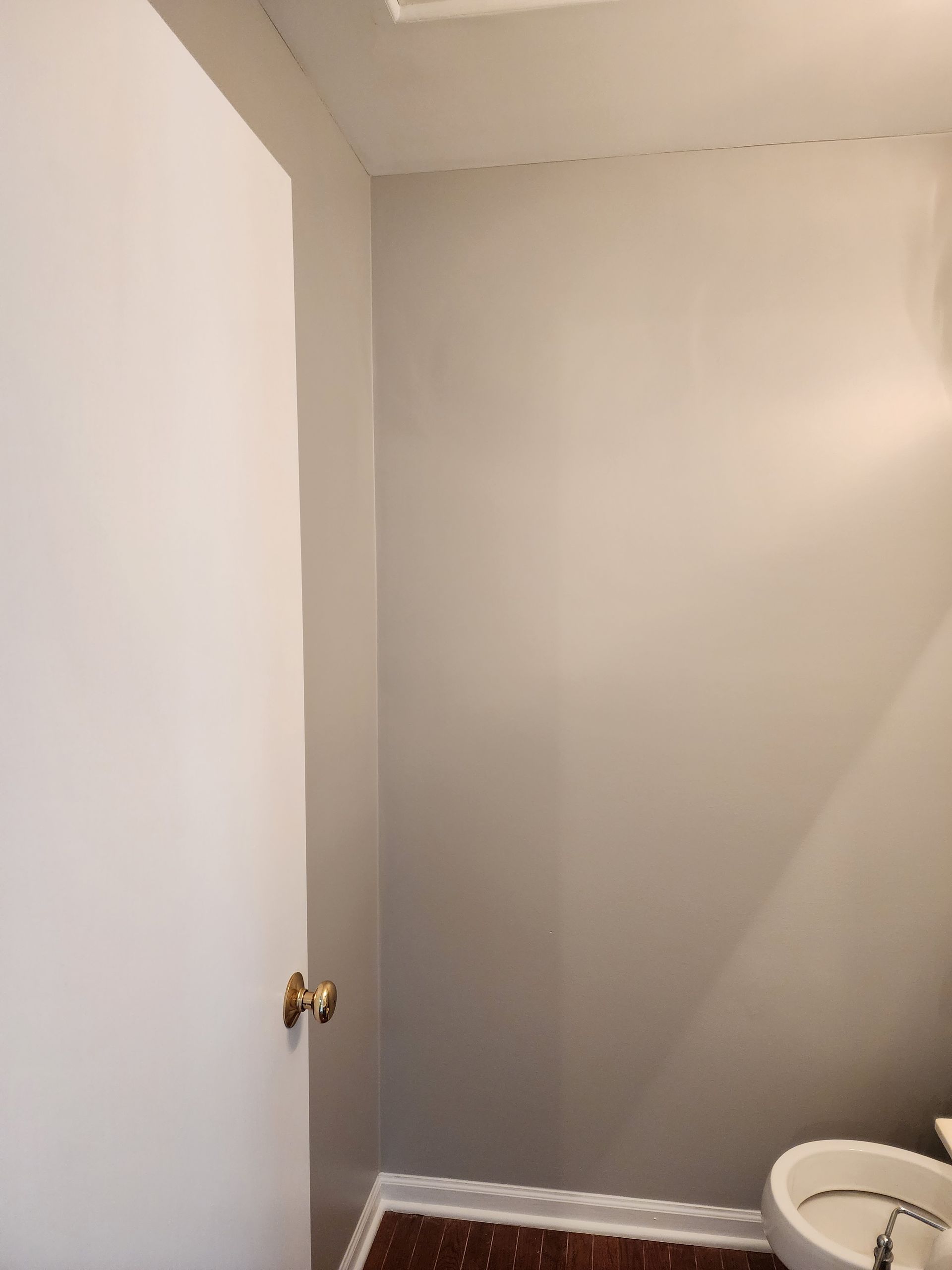 A bathroom with a sink and a white door