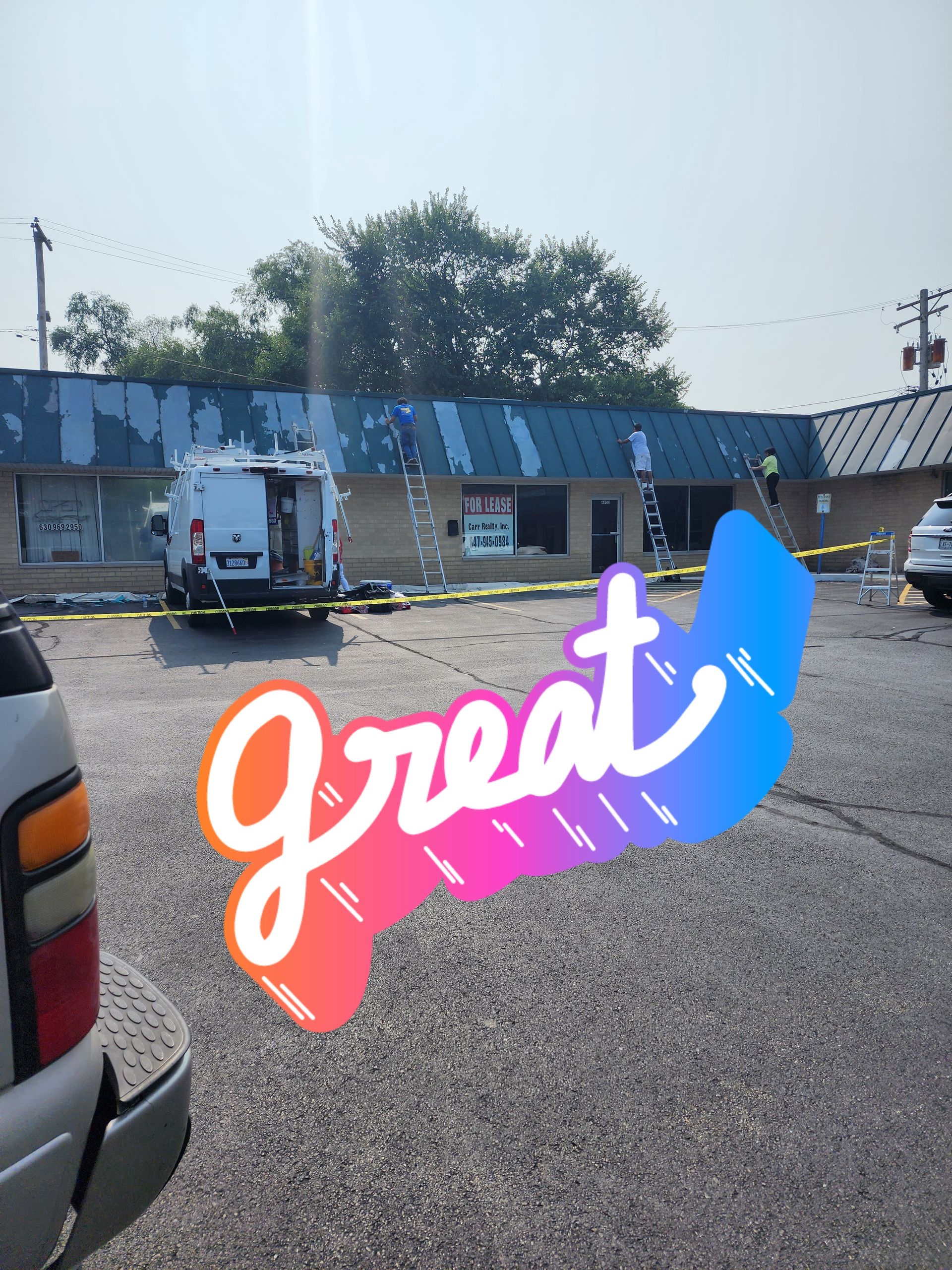A truck is parked in front of a building that says great