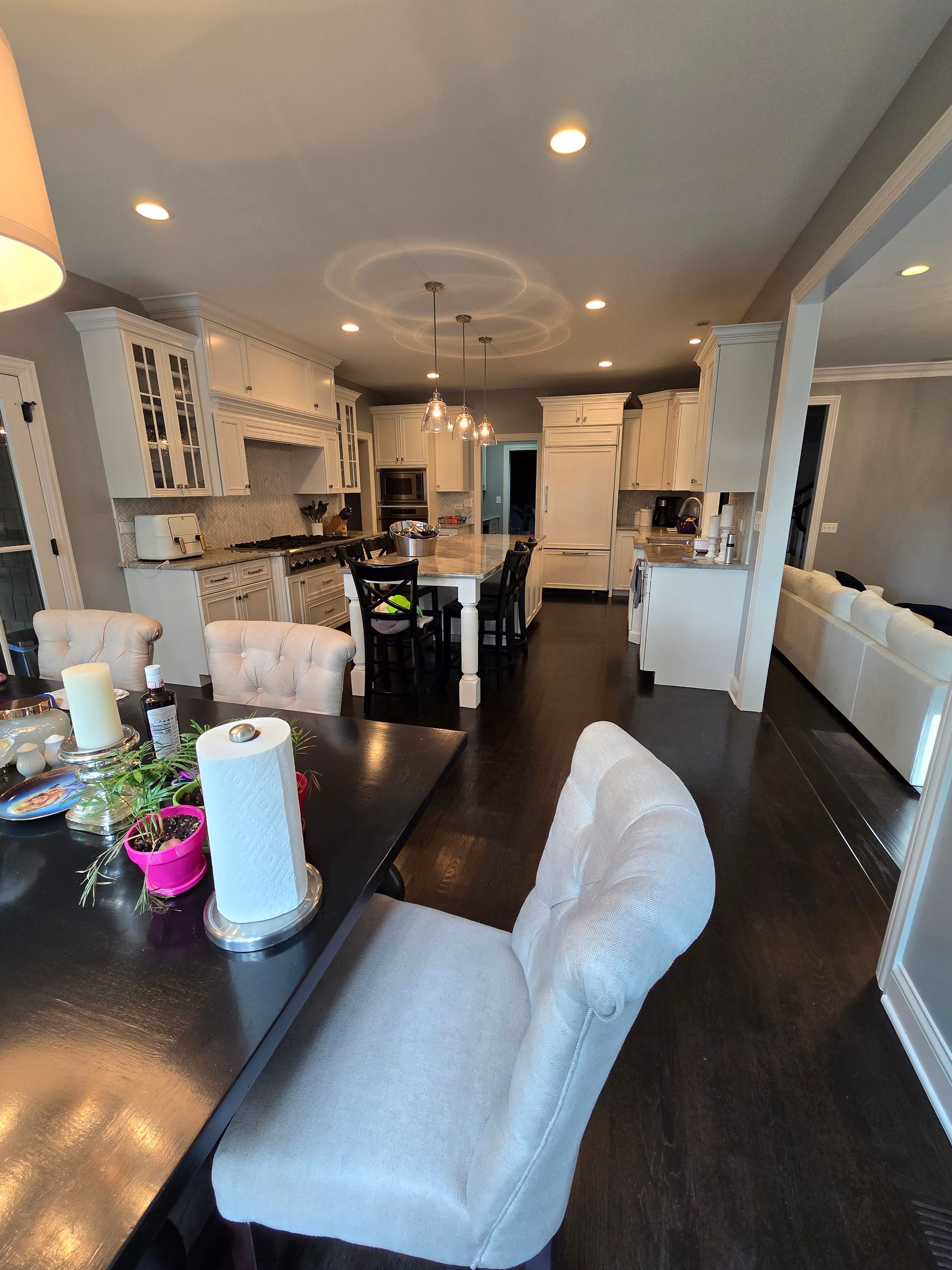 A kitchen with a table and chairs in it