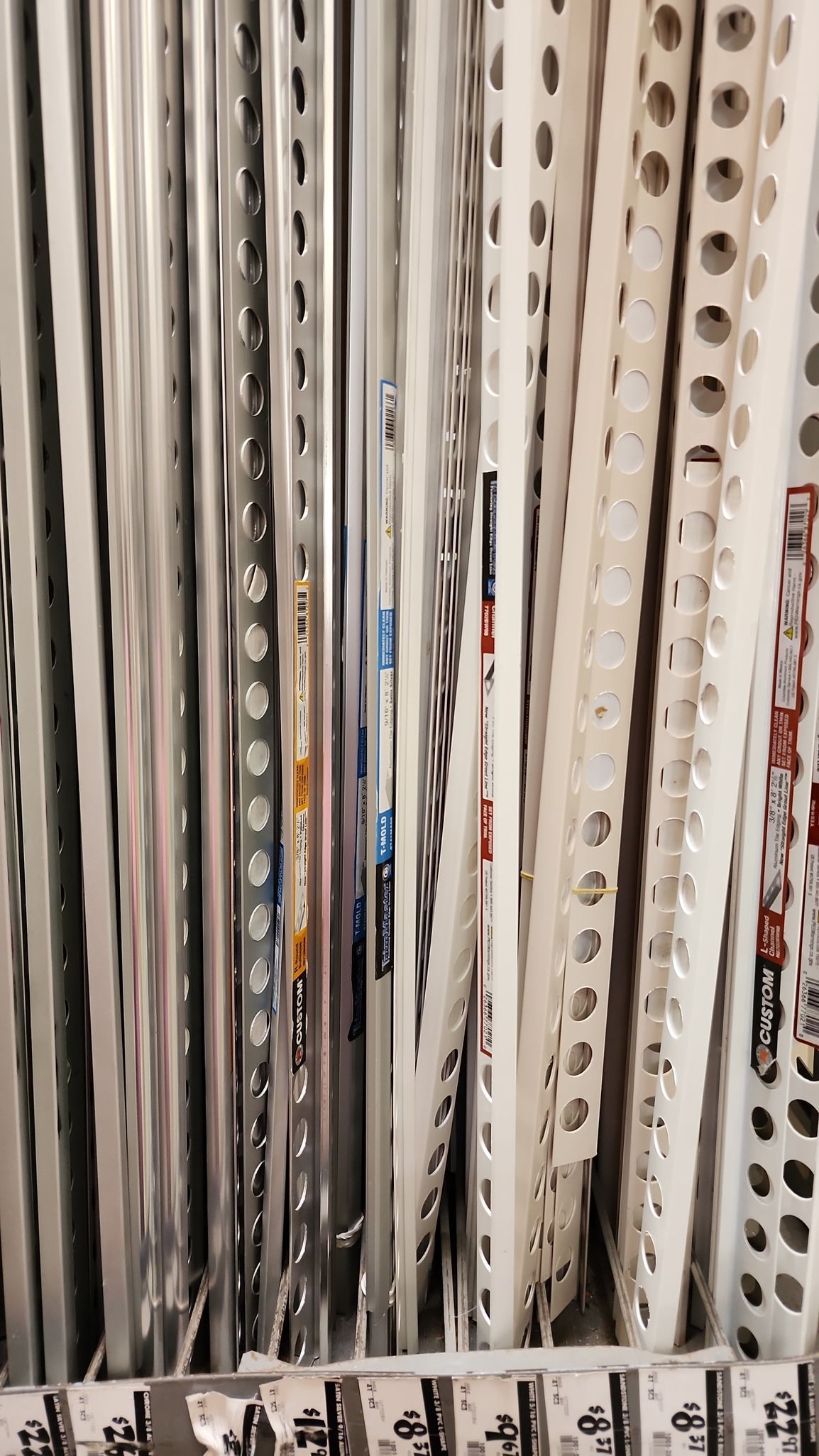 A bunch of records are stacked on top of each other on a rack.