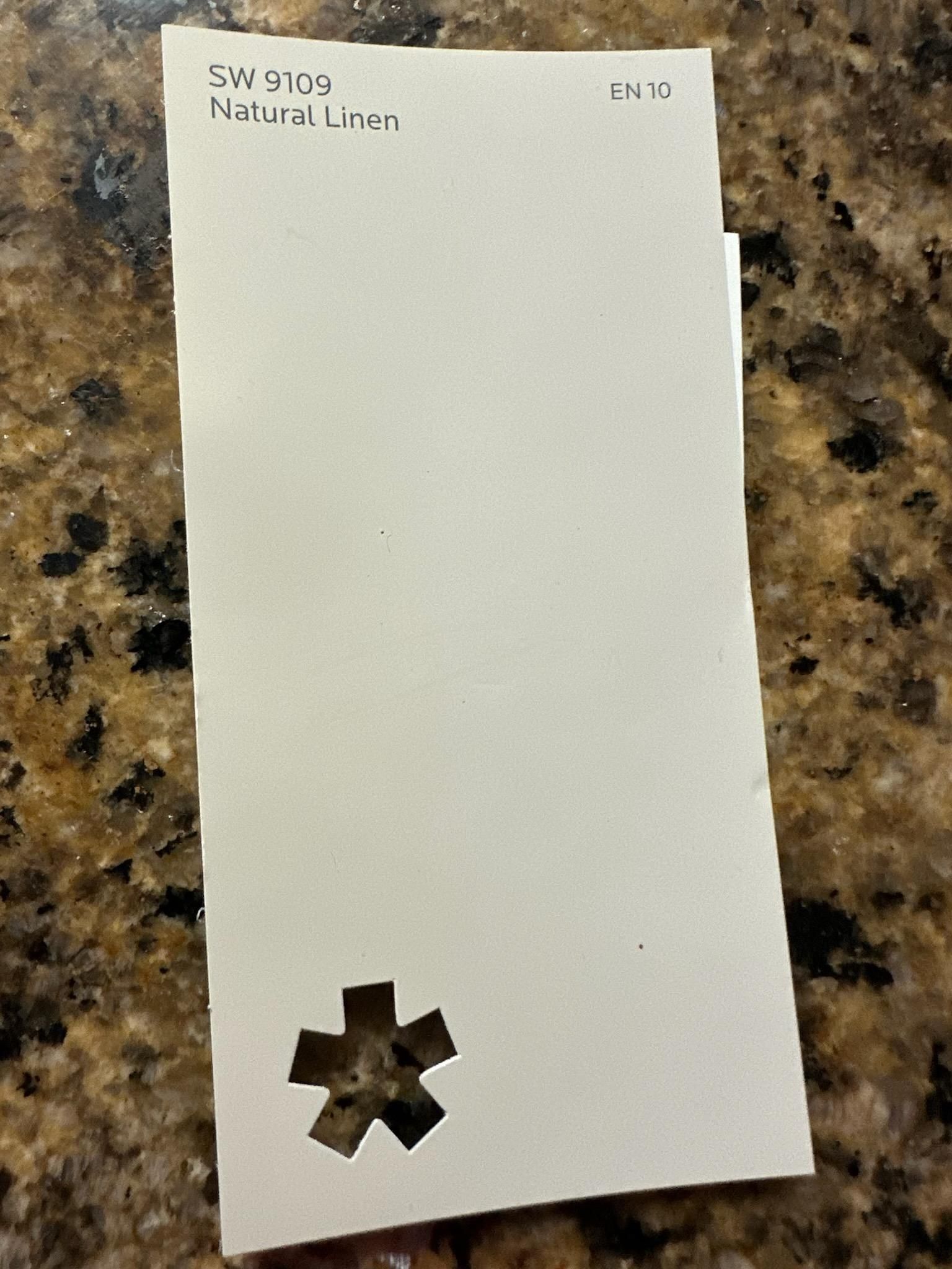 A piece of paper with a star cut out of it