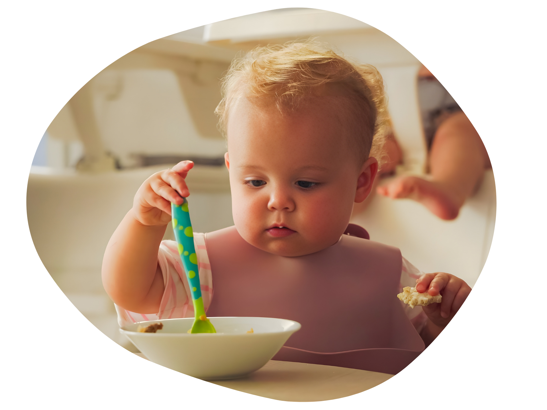 Family posing on a boardwalk near a beach; two adults, two children.