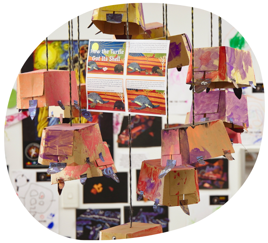 Children in blue coats walk through a pine forest, collecting items.