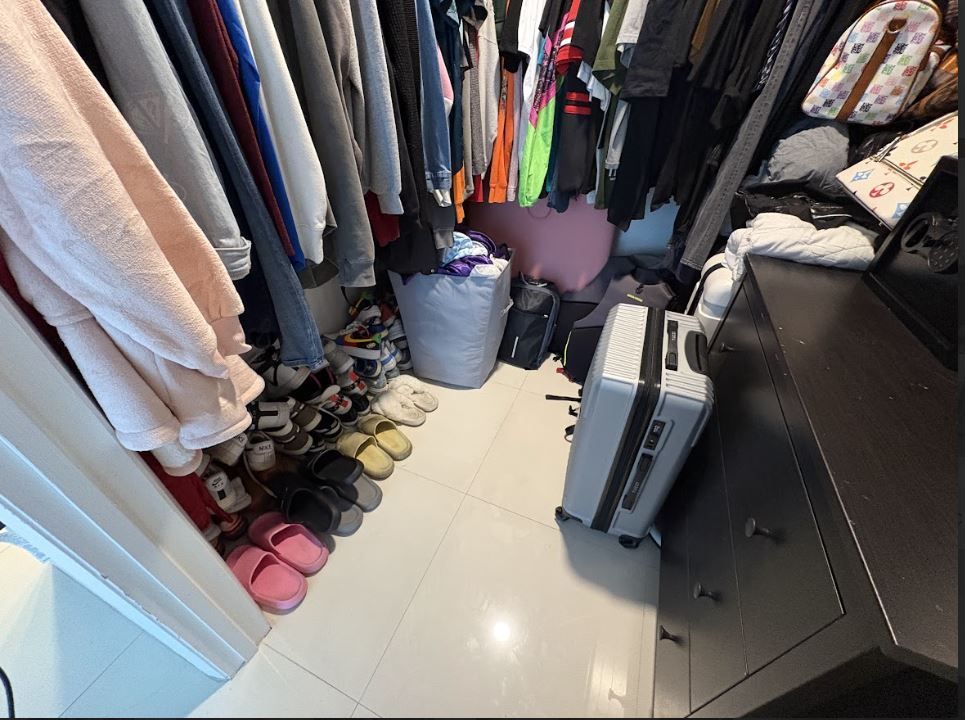 A closet filled with lots of clothes and shoes