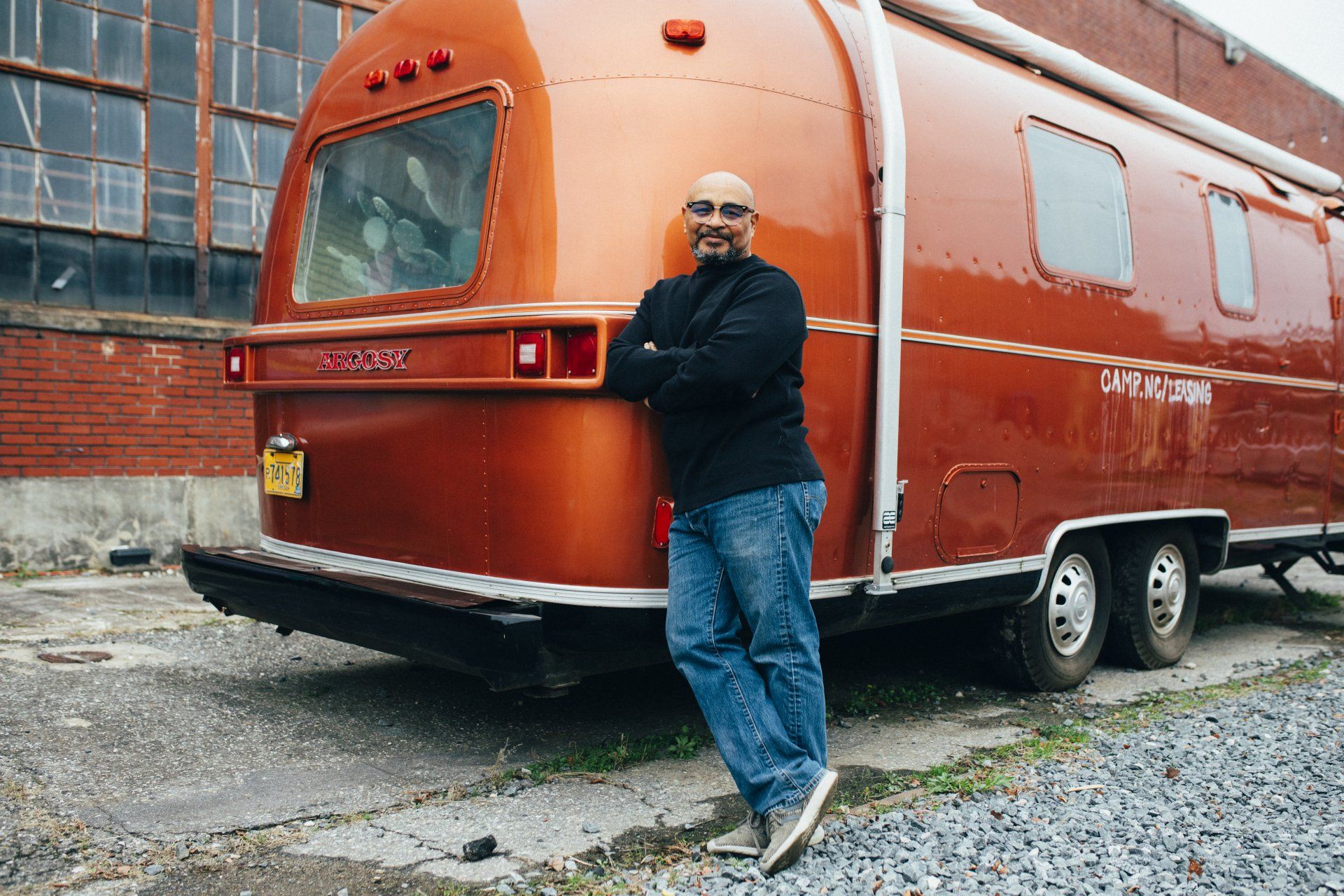Man Leaning on His RV