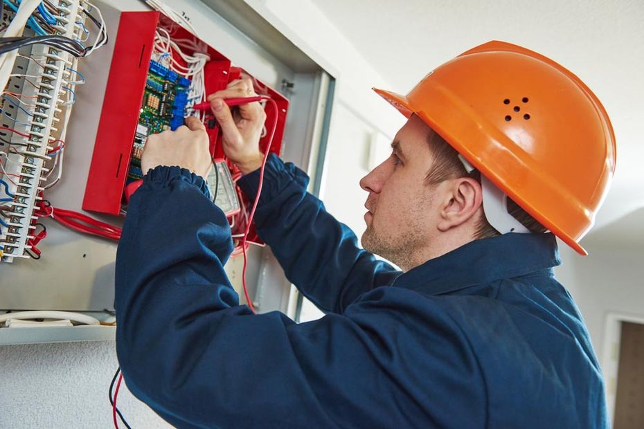 Electrician Fixing Switchboard — Electrical Service in Swansea, NSW