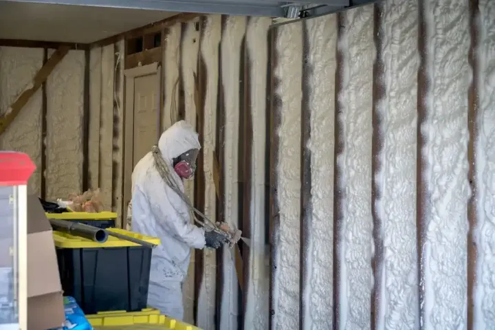 Blown in fiberglass insulation filling attic space