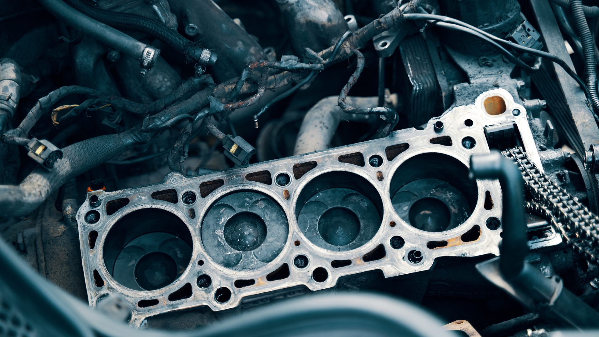 A close up of the cylinder head of a car engine.