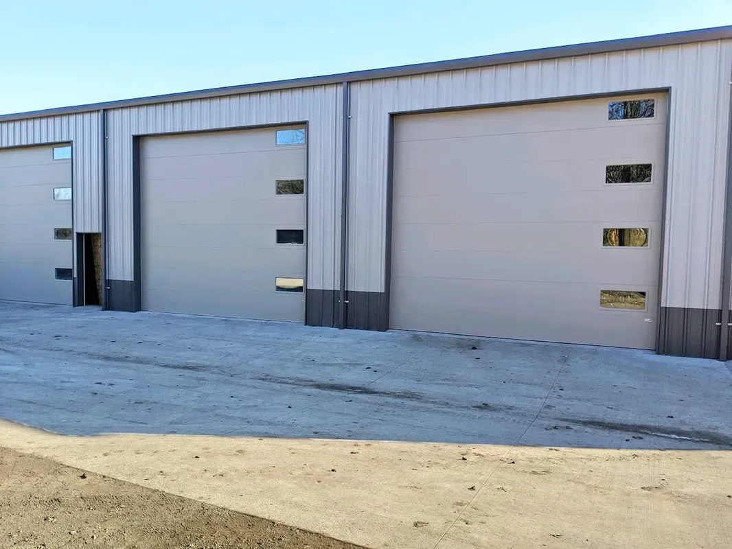 Midland 3-Inch ThermoGuard In Sandstone With Insulated Lites — Beatrice, NE — Blue Valley Door Co. Inc.