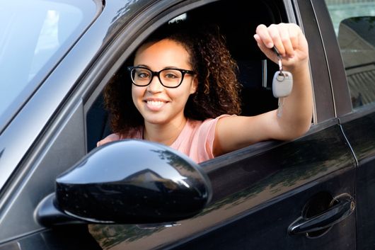Driving School — Woman Holding Driver's License in Shreveport, LA