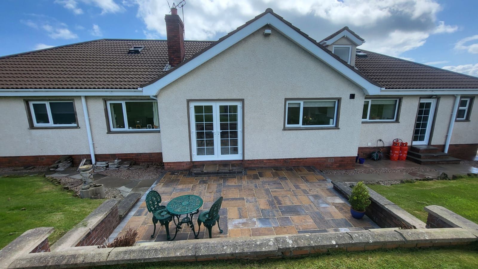 A large house with a patio in front of it