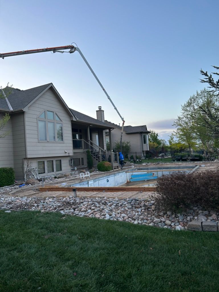 A large house with a pool in the backyard is being built.