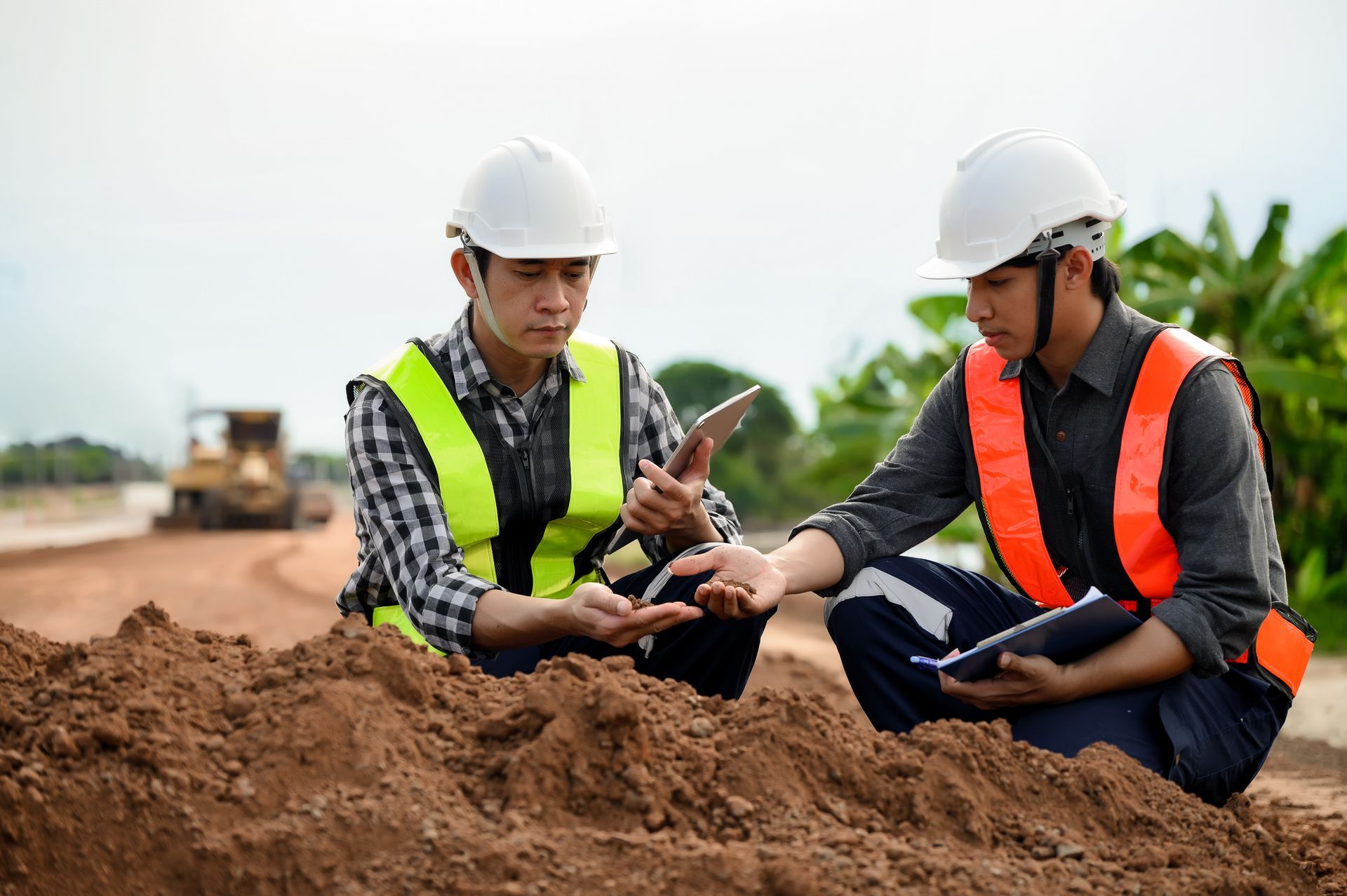 Engineer inspecting soil sample at construction site Gold Coast.