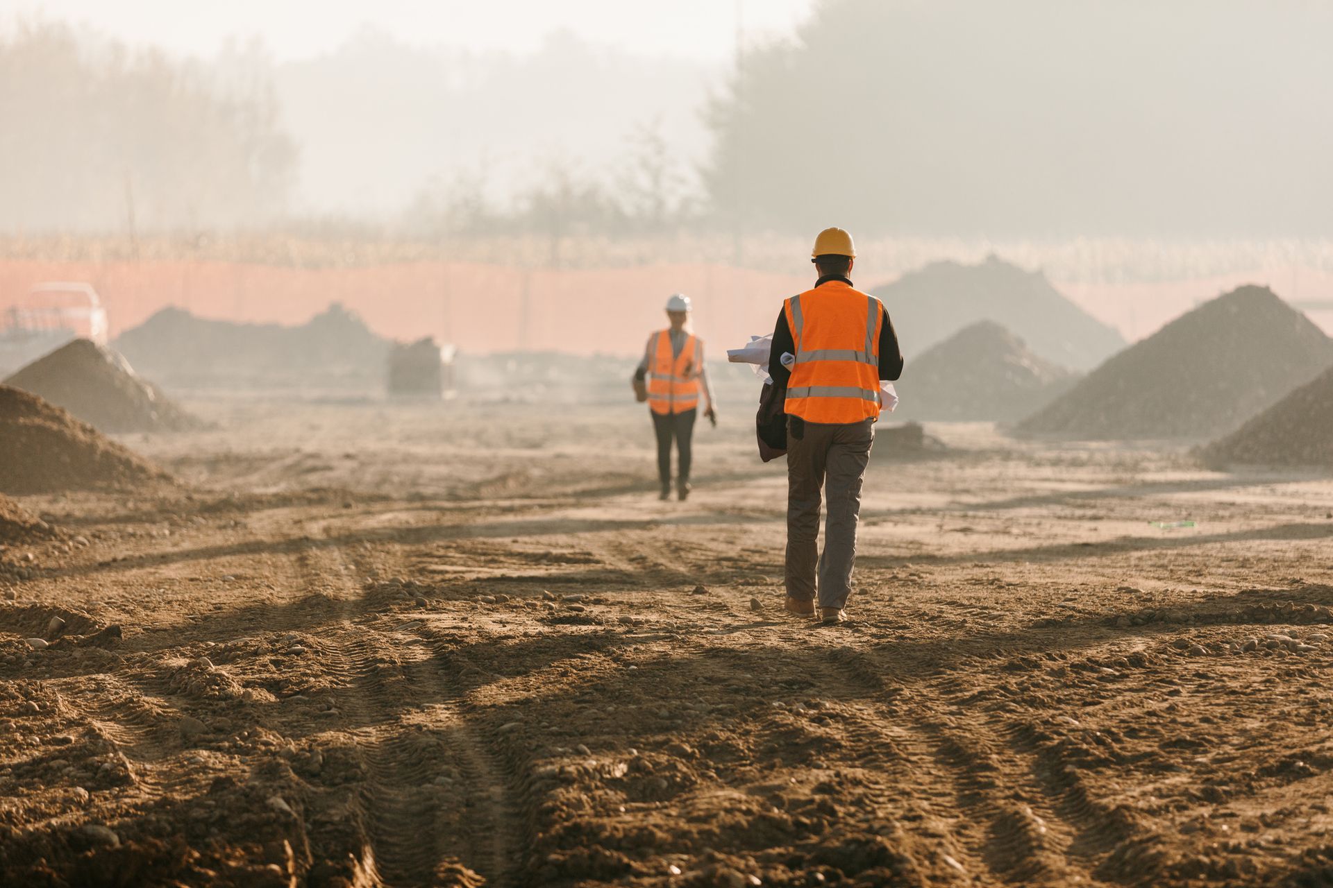 Building contractors are evaluating work at a construction site.