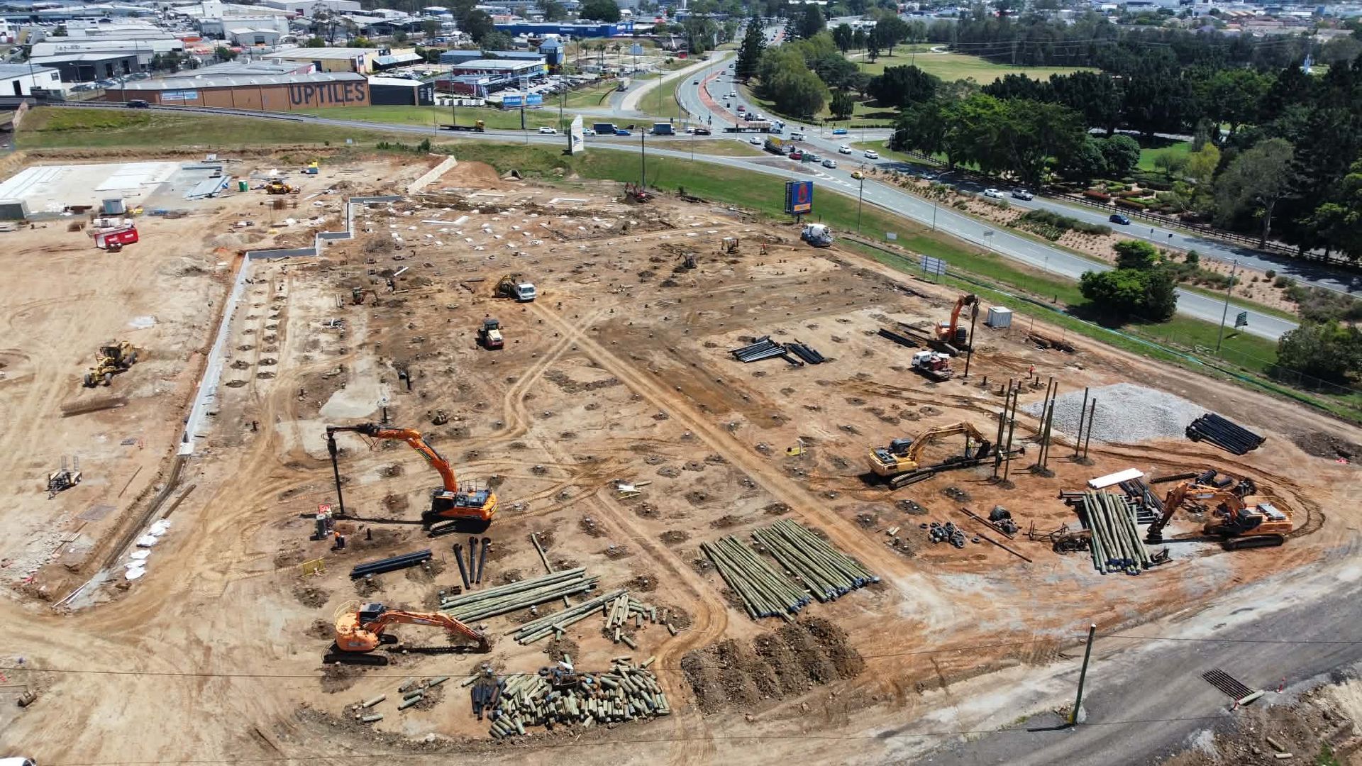 Aerial view of large commercial construction site with timber piling works underway by a piling contractor in the Gold Coast QLD.