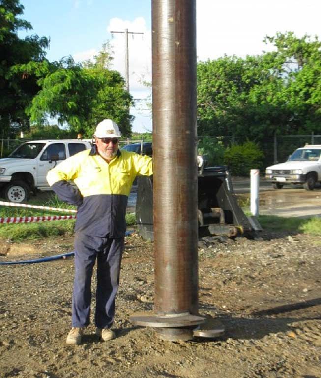 Man Beside Huge Pile — Southeast QLD — East Coast Group of Companies