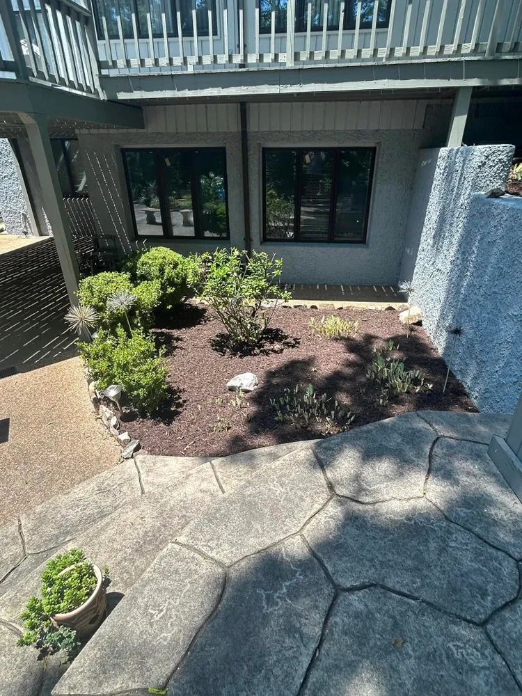 An aerial view of a garden in front of a house.