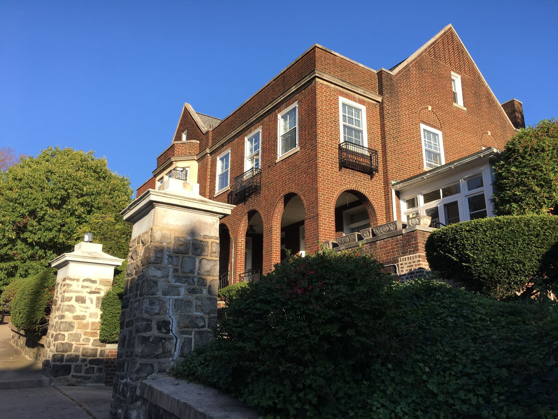 A large brick building with a blue sky in the background