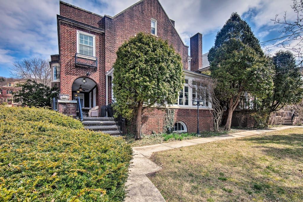 A large brick house with trees in front of it