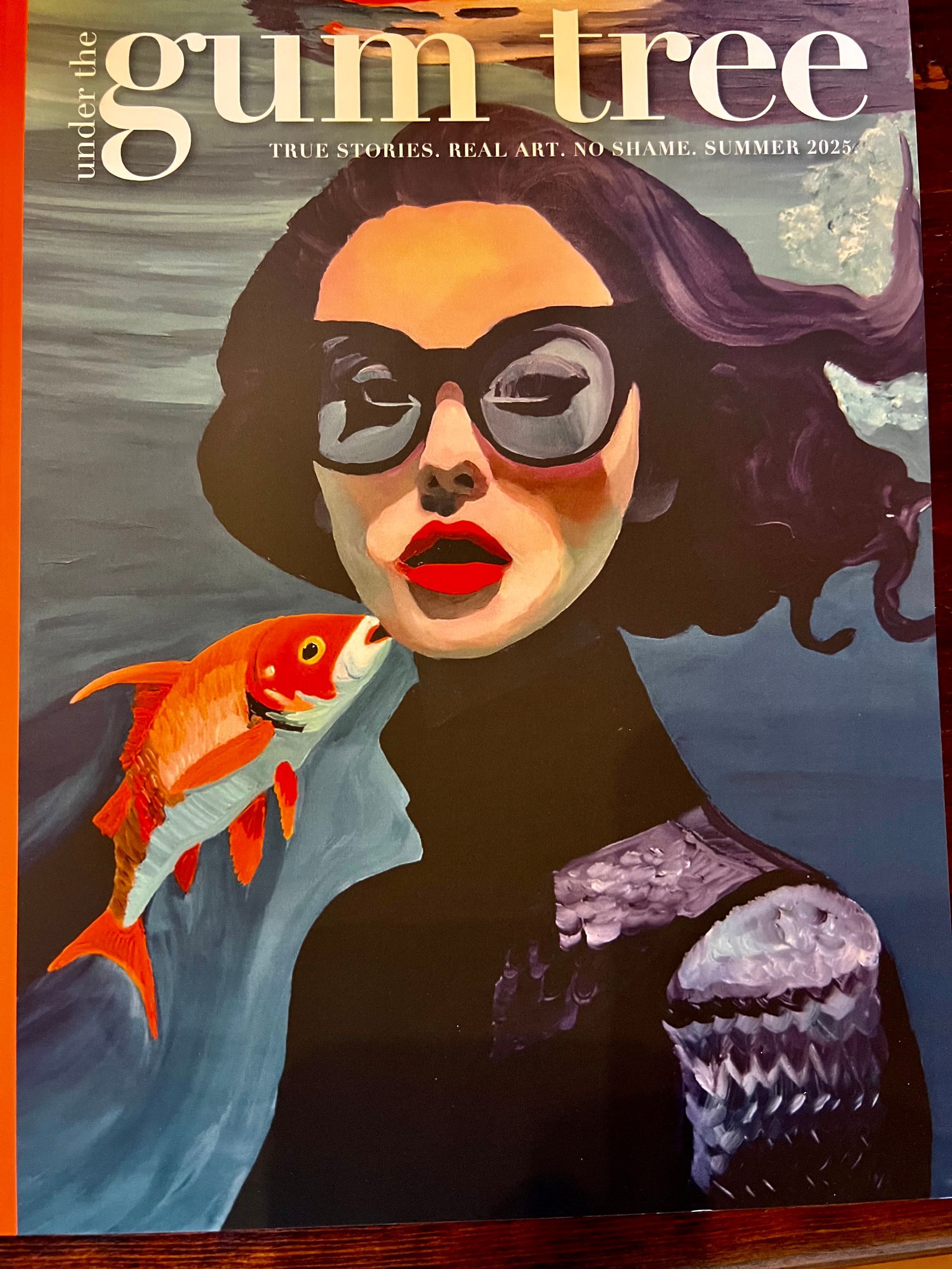 Painting of a woman with sunglasses and a koi fish
