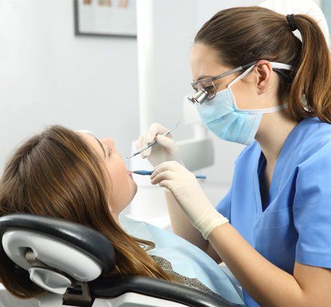 Phone Services — Dentist Examining Patient's Teeth in Calabasas, CA