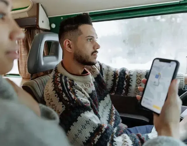 Two People are in a car, looking at Google Maps, displaying our Local Map Listing Service To Help People Find Your Business.