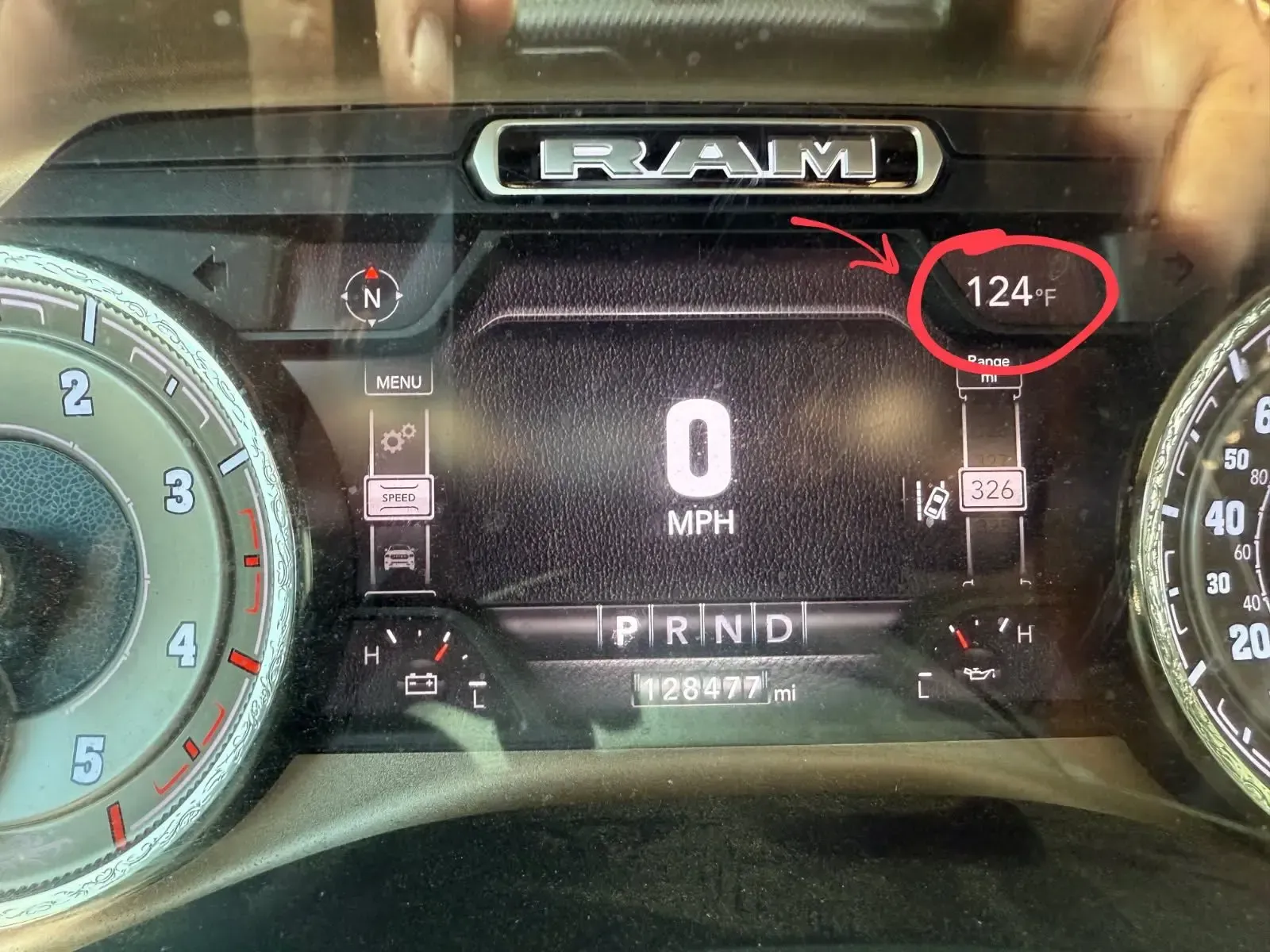 Car dashboard showing 0 MPH, with a 
