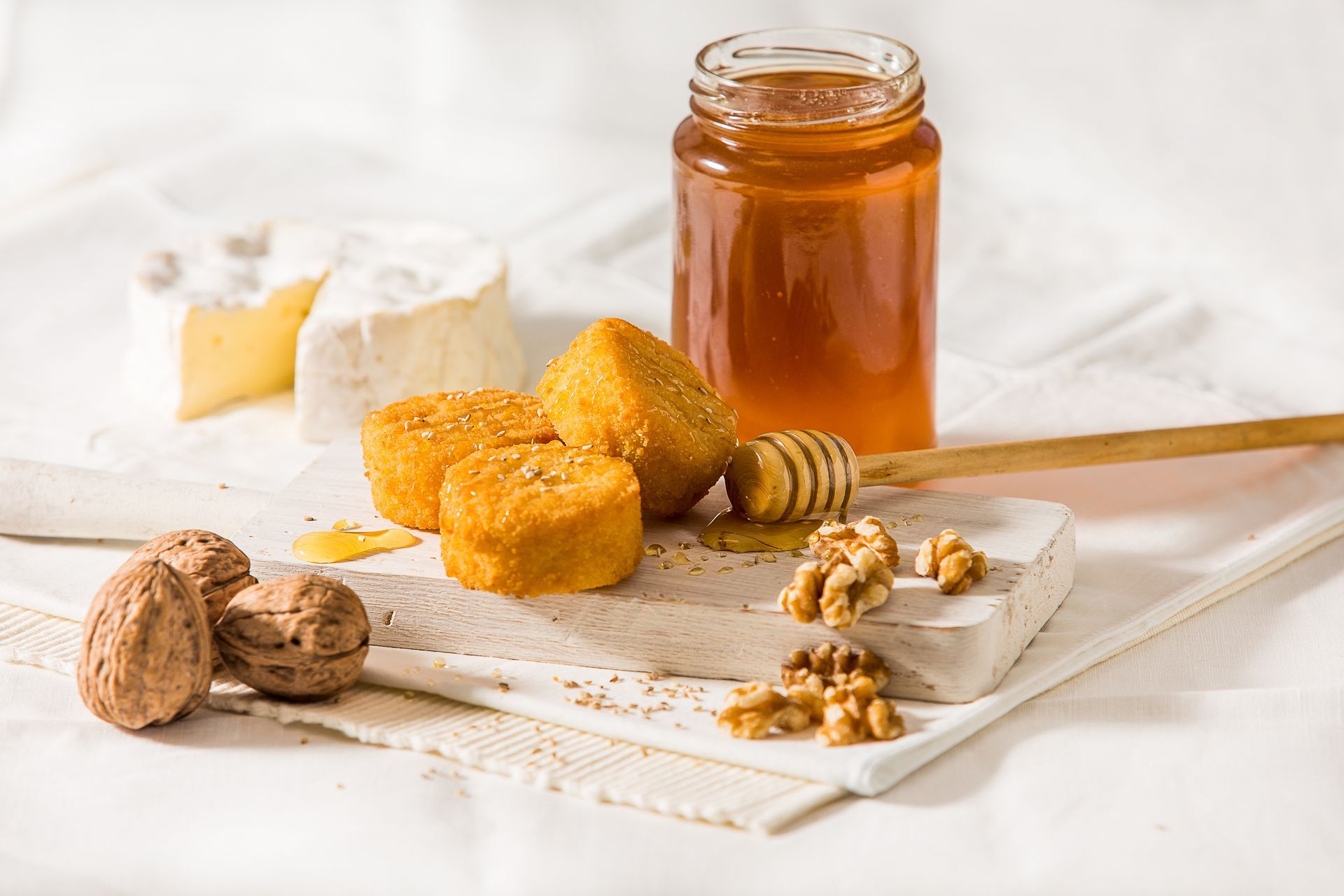 Mini goat cheese tapas with honey and walnut board