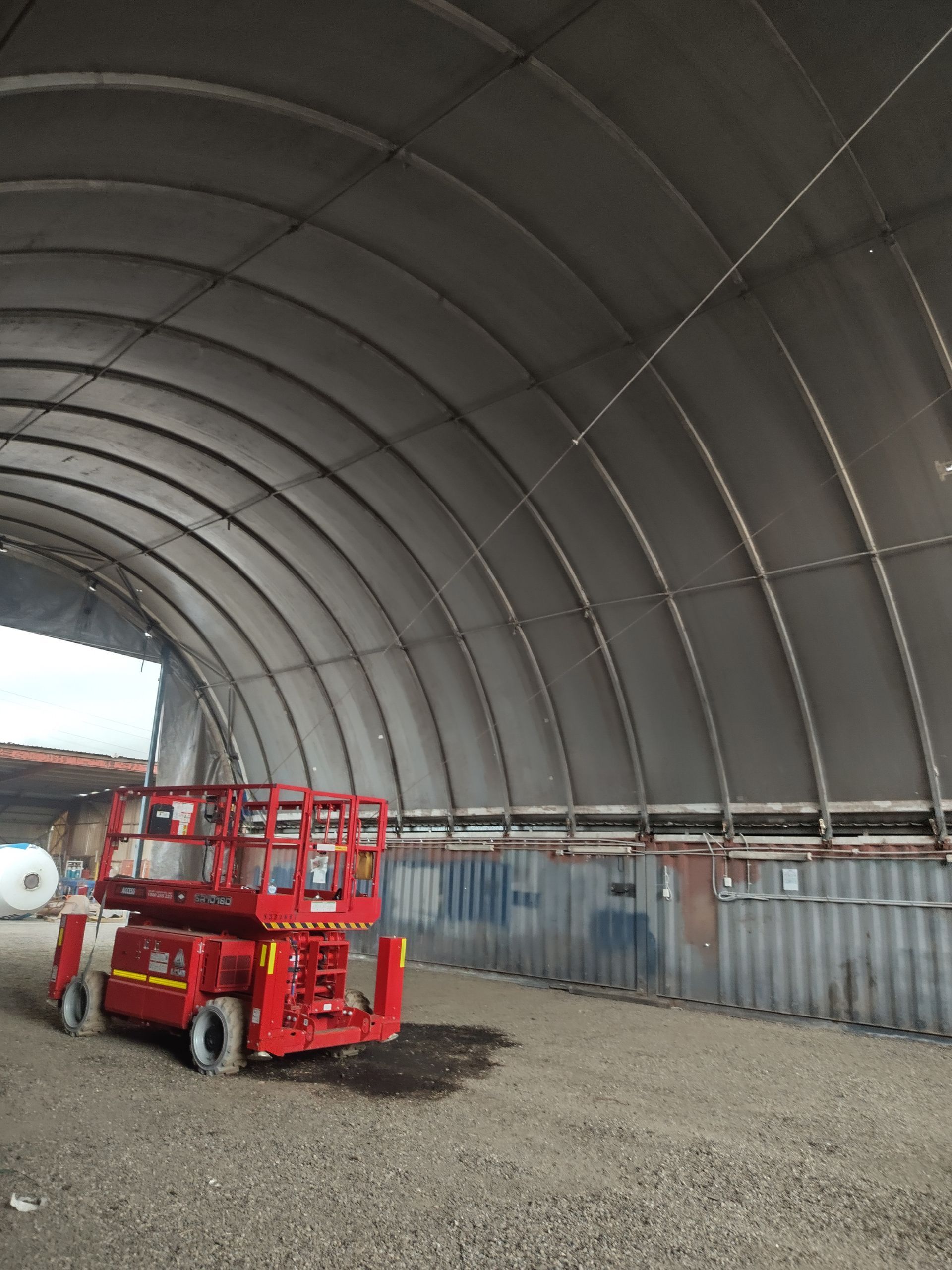 White geodesic dome structure against a black background.