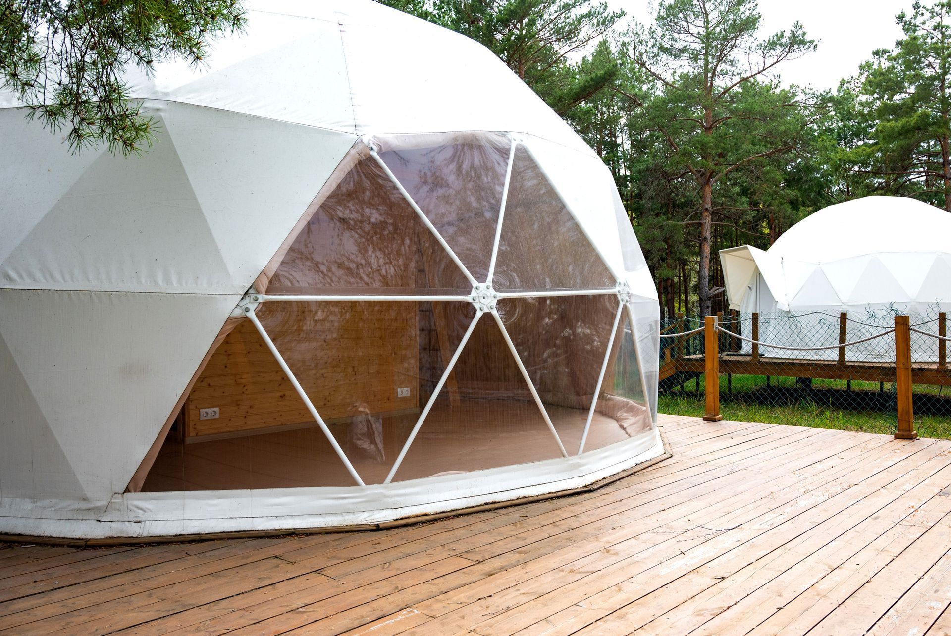 Unique dome accommodations nestled in a forest.