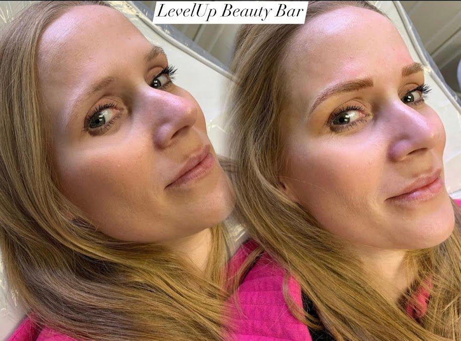 A woman with blonde hair is looking at herself in a mirror.