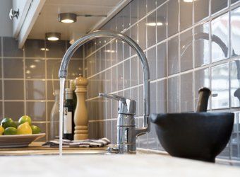 Pouring Water — Plumbing Service in Hudson, IL