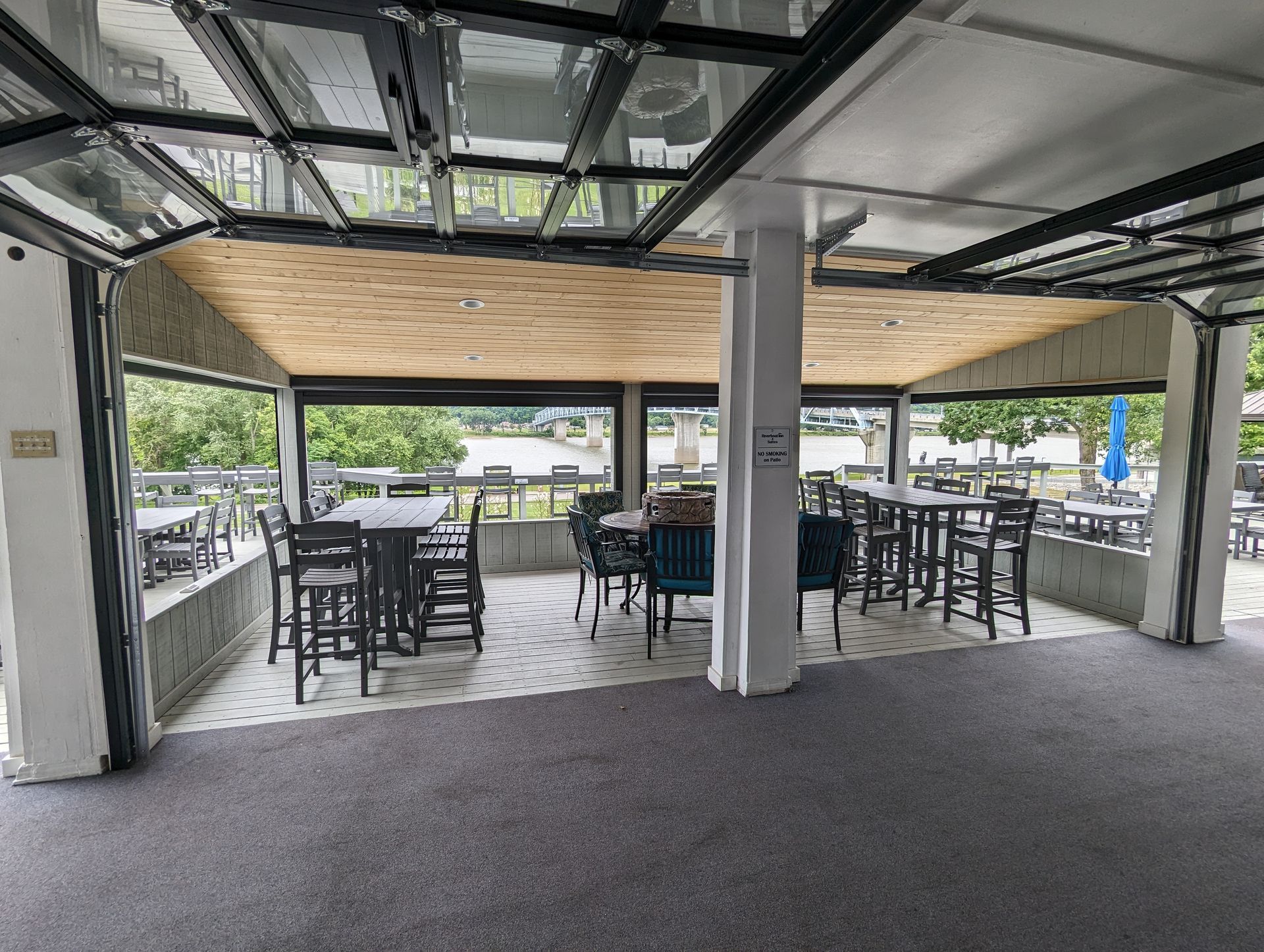 A large room with tables and chairs in it.
