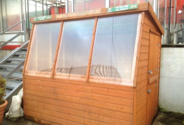 Potting shed with glass side windows