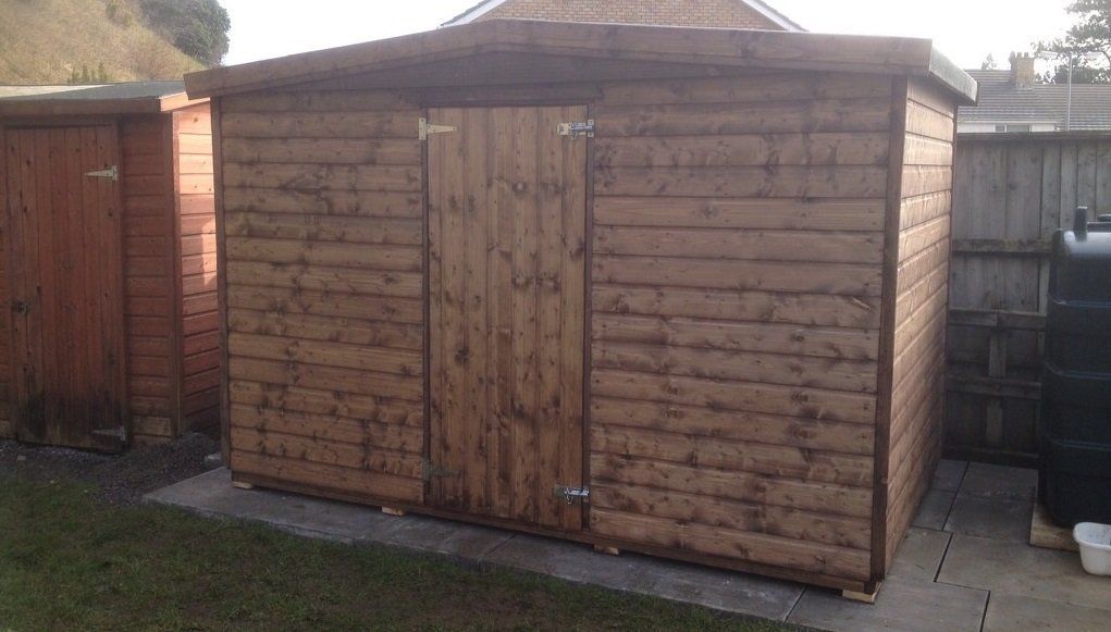 Large dark wood shed