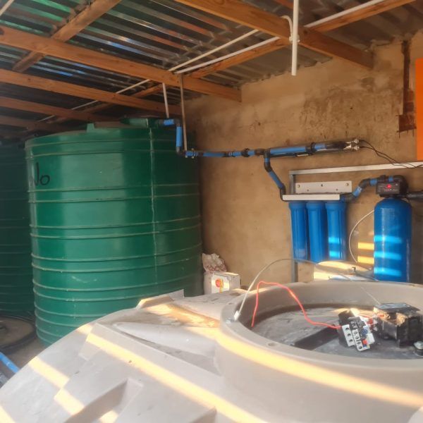 A room with a lot of water tanks including one that has the number 10 on it