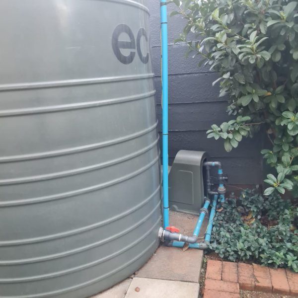 A large gray water tank with the word ec on it