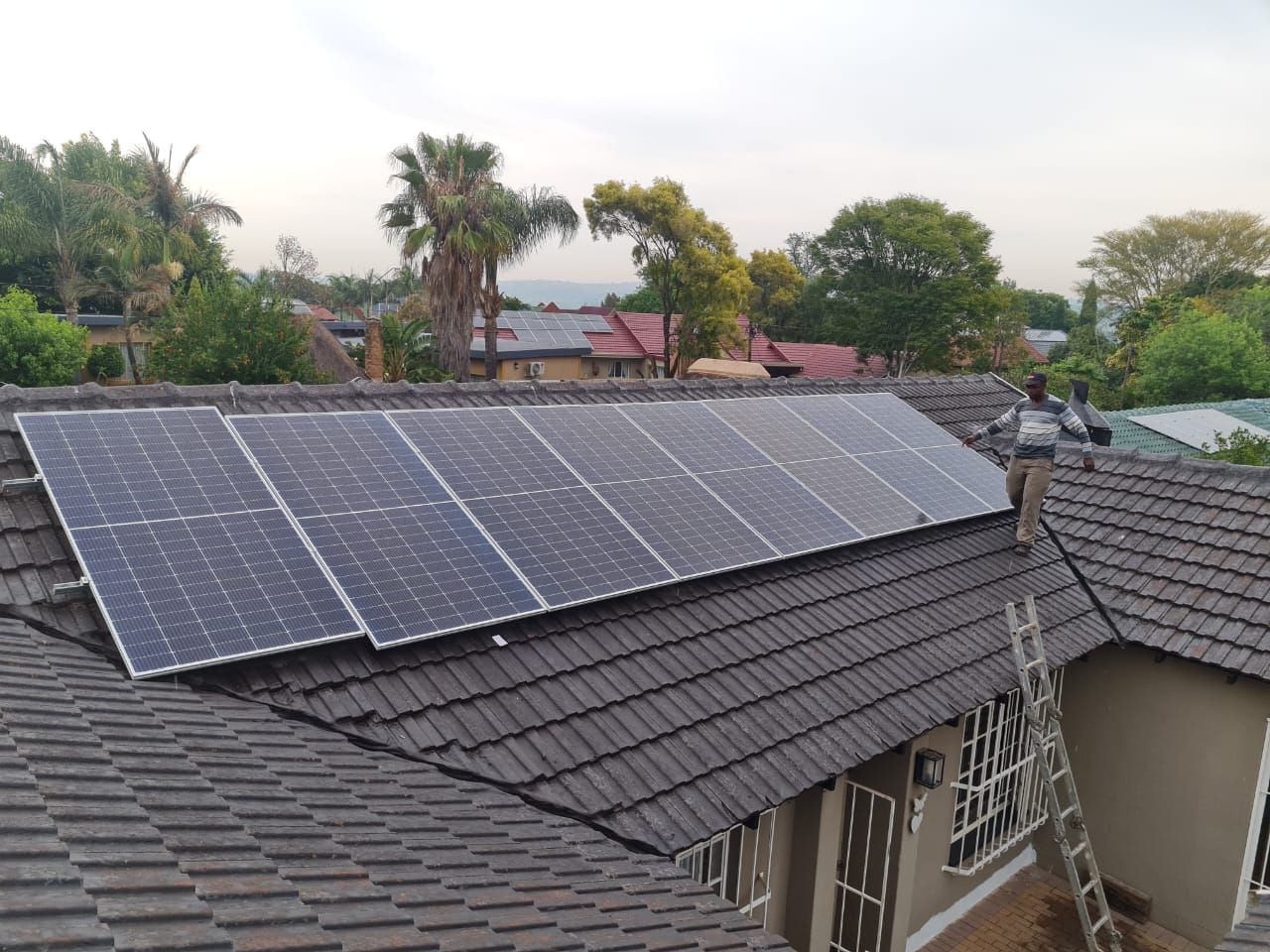 A roof with a lot of solar panels on it