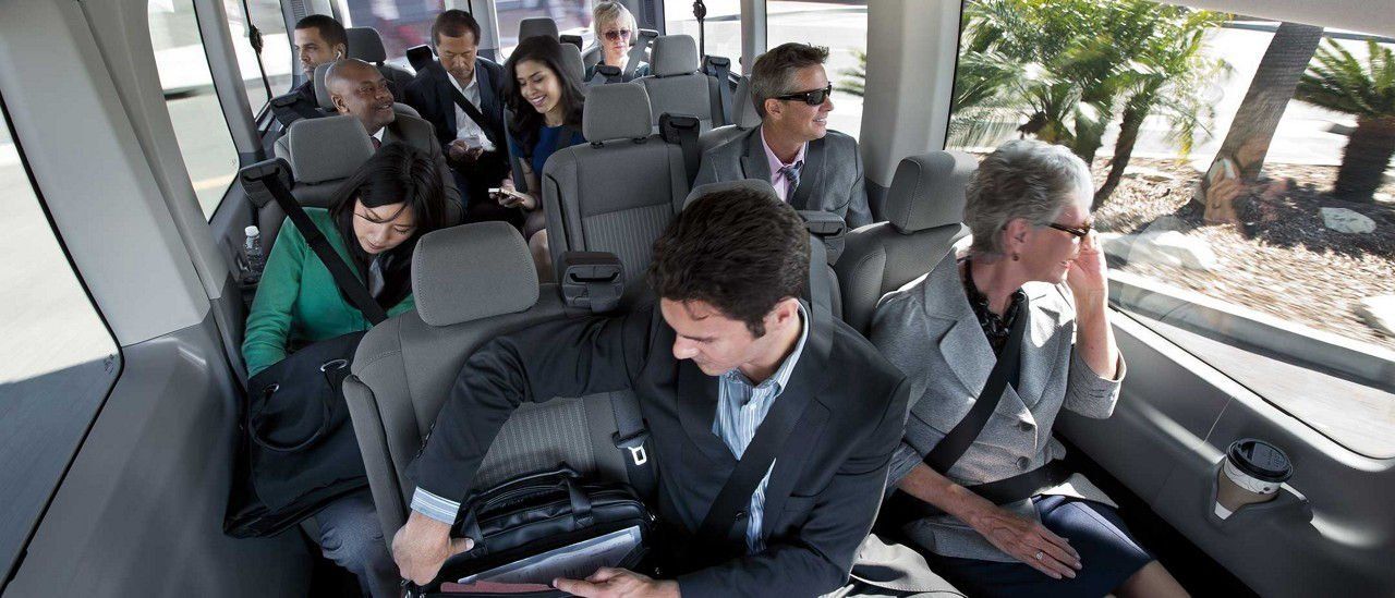 passengers settling into tour bus seats