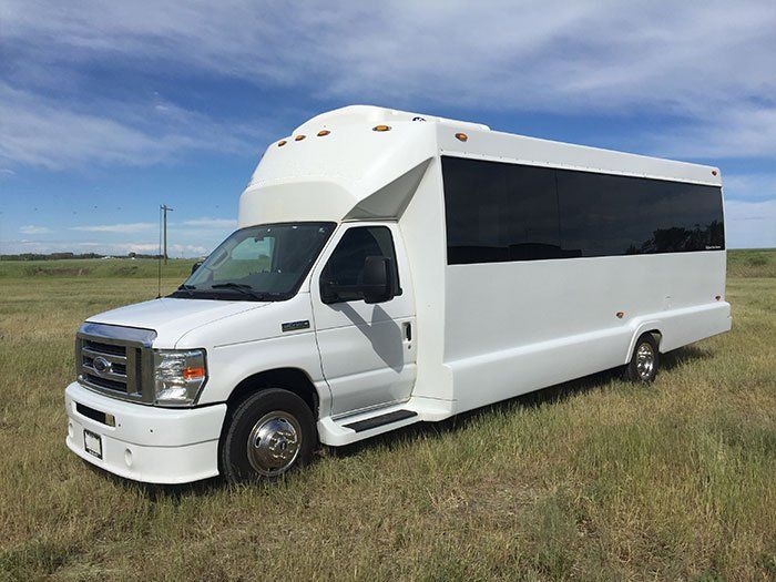 white E450 20 passenger party bus exterior