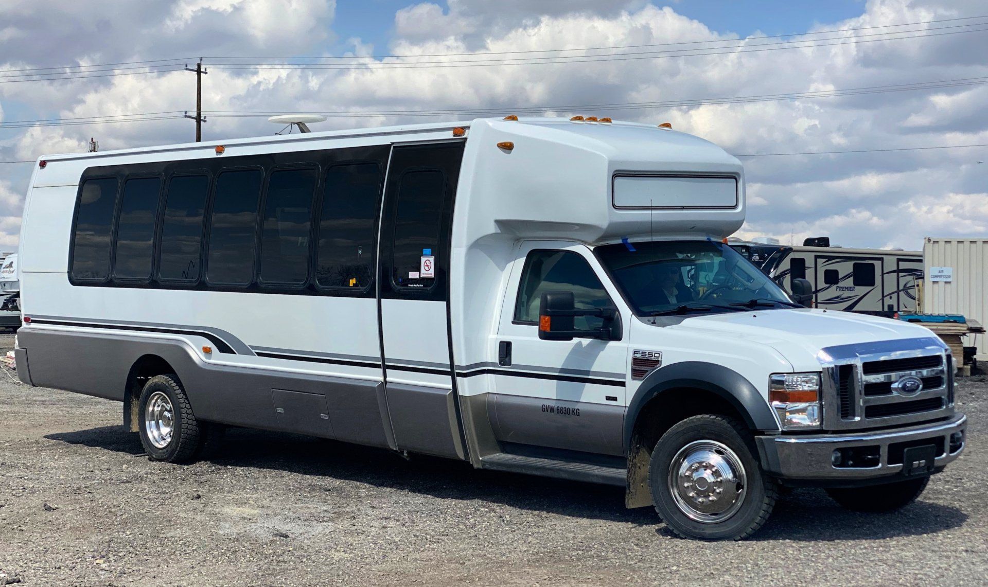 Limo To Go Krystal Coach 24 passenger white party bus exterior side view