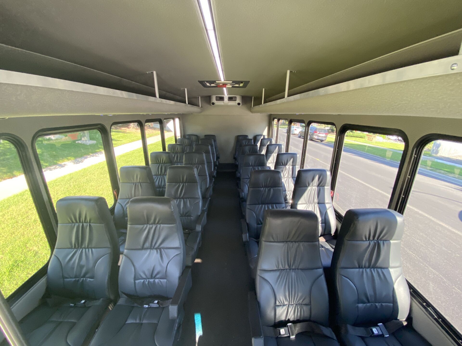 white Limo To Go 24 passenger executive Turtletop shuttle bus interior seating view