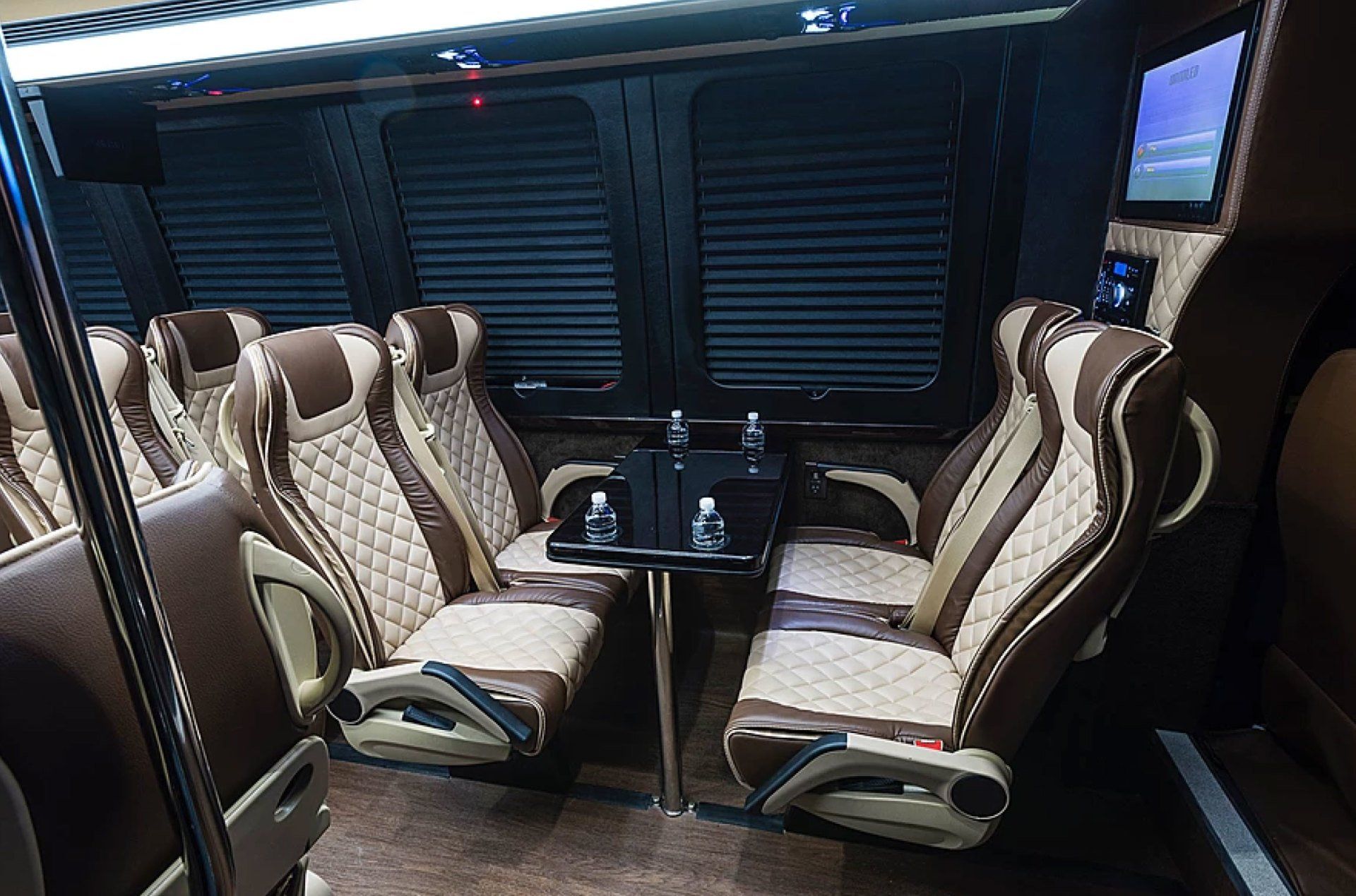 Limo To Go 47 passenger motorcoach shuttle bus front conference table with seating
