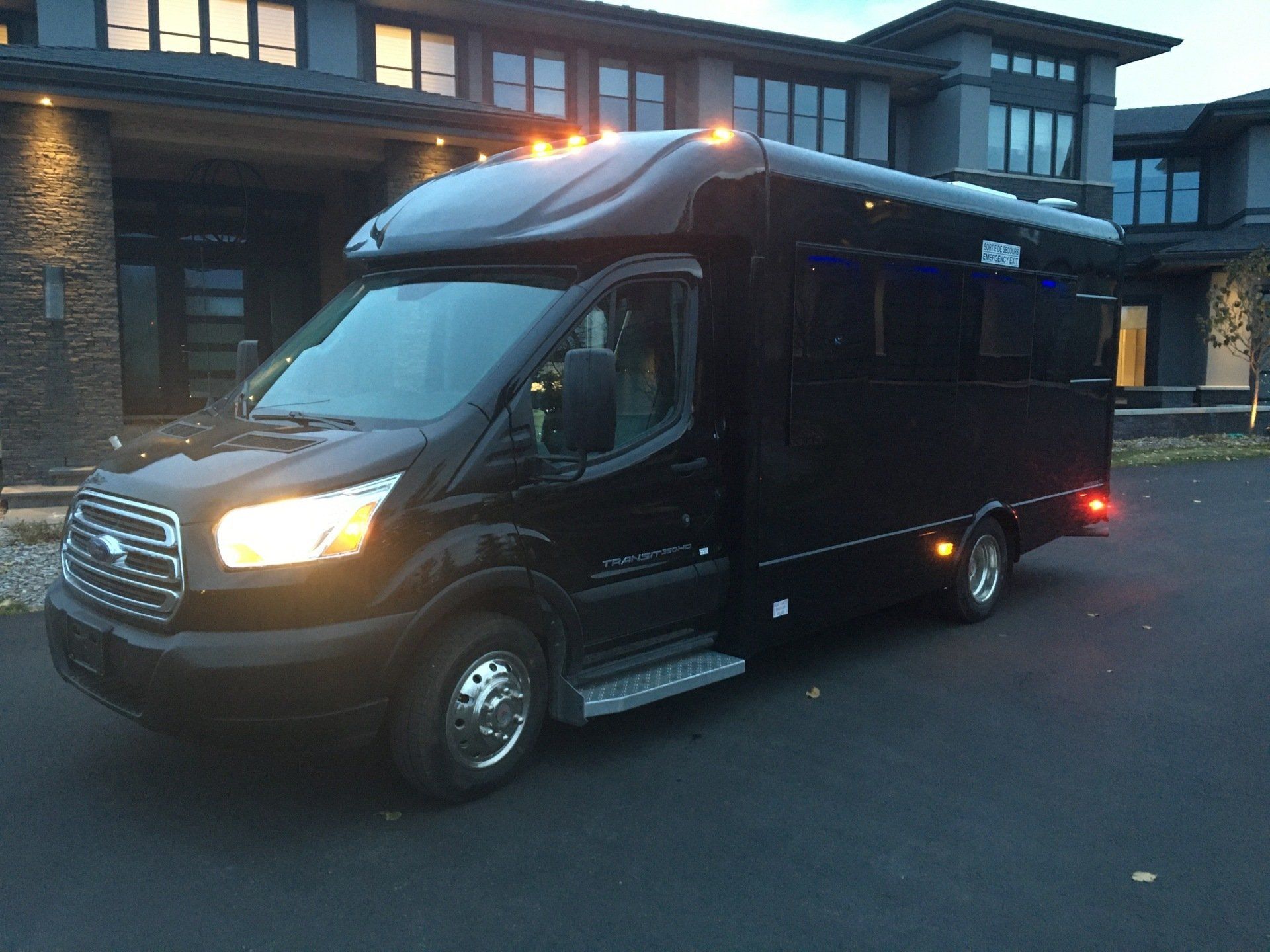 Ford Transit Battisti Limo To Go 12 Passenger black party bus exterior