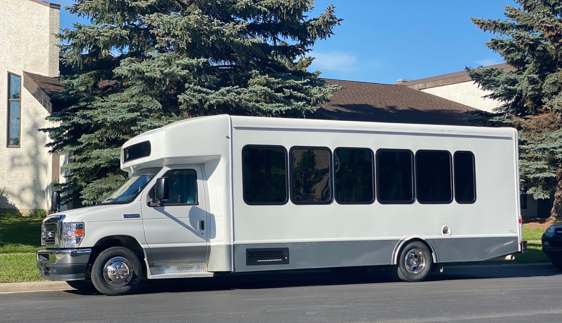 white Limo To Go 24 passenger executive shuttle bus exterior